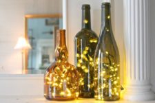 DIY wine bottle lanterns with Christmas lights
