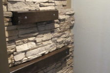 DIY installing faux stone on the accent wall