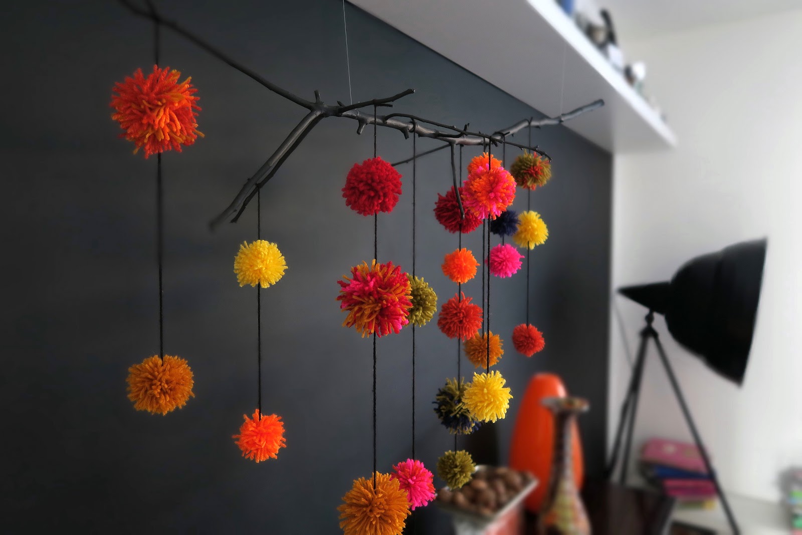 DIY branch and pompom wall decoration (via https:)
