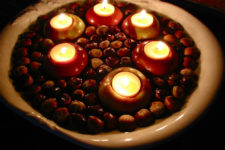 DIY floating chestnuts and apples with candles for a centerpiece