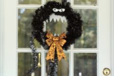 DIY Man Eating Wreath from black tinsel for Night Before Christmas