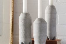 DIY concrete candle holders of plastic bottles