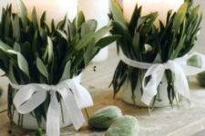 02 candle with leaves wrapped around it and ribbon bows looks fresh and elegant