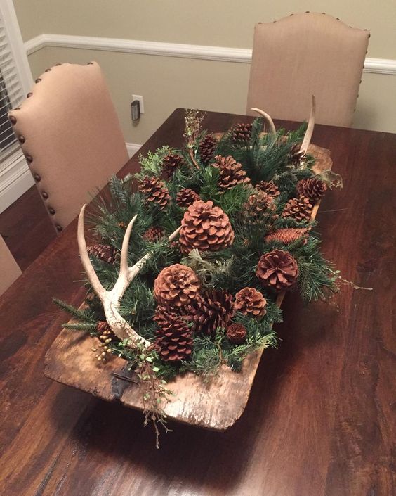 vintage rustic dough bowl with pinecones and evergreens