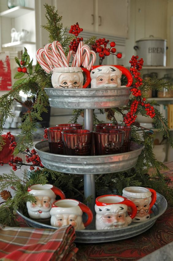 a hot chocolate station with a galvanized stand and vintage cups