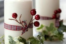 04 candles wrapped with berries, ribbon and leaves