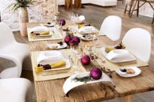 09 a rustic table with purple ornaments and gold napkins look chic
