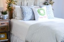 09 chic fir garland with lights and white snowflakes over the bed