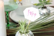 10 a disco ball with airplant as a card holder