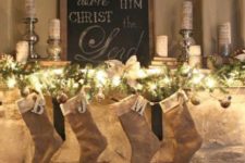 11 a lit garland and burlap stockings can be enough for Christmas mantel decor