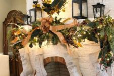 13 a lush whimsy garland with a large tan bow and industrial stockings