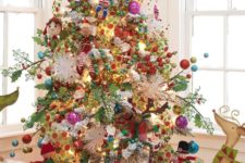 13 a super bold whimsical tree decorated with toys and ornaments