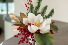 14 magnolia and berried Christmas arrangement