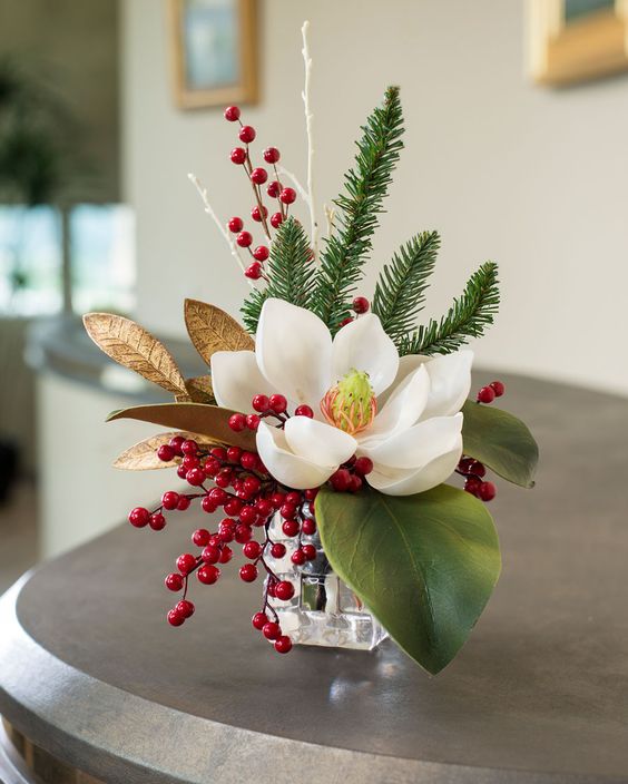 magnolia and berried Christmas arrangement
