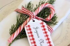 14 striped ribbon, rosemary and a candy cane for decorating a napkin