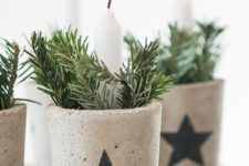 15 concrete pots with stars filled with evergreens