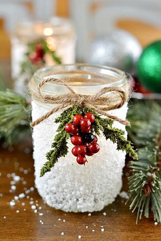 decorate candle lanterns with faux holly berries and sprigs