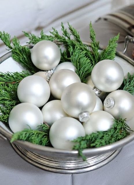 display your pearl colored balls in a silver bowl with evergreens