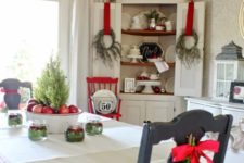 17 messy wreaths with red ribbon and evergreen chair hangings