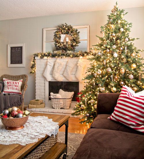 a large lit up tree with ornaments and pinecones will easily create a festive mood