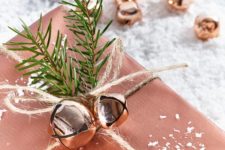 20 copper wrapping paper, twine, evergreen sprigs and copper bells