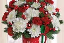 21 hot cocoa mug with a lush green, red and white arrangement and a green spoon