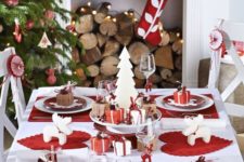 21 red and white tablescape with whimsy-shaped candles, gift boxes and red placemats