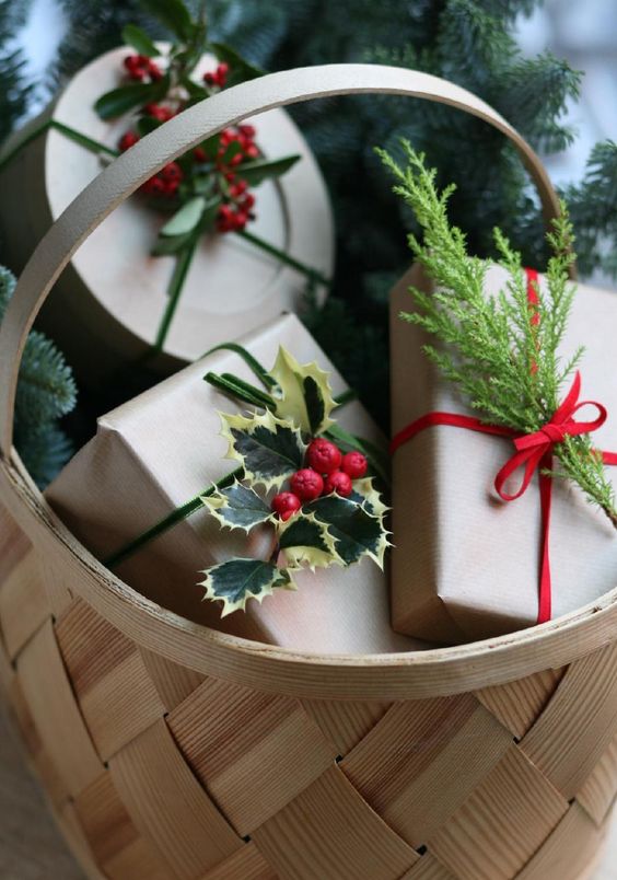 top gifts with holly berries and leaves for a festive touch