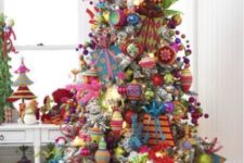 24 too much is never enough for Christmas decor, these bold ornaments make the tree invisible