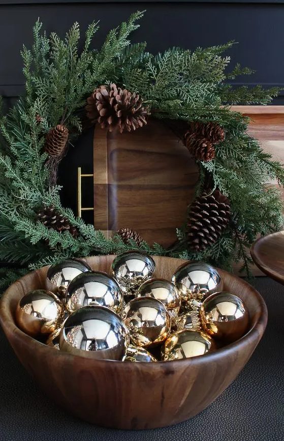 a simple timber bowl with shiny gold ornaments is a simple last-minute decoration to rock for the holidays