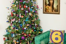a super bright Christmas tree with very colorful ornaments and garlands plus bold beads and lights