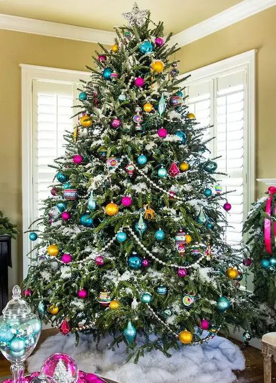 A vintage inspired Christmas tree with beads, colorful ornaments of various shapes and a star on top