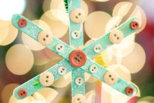 DIY popsicle stick snowflake with buttons