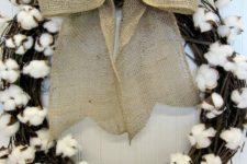 DIY grapevine wreath with cotton and a burlap bow