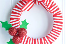 DIY red and white Christmas wreath with holly berries and leaves