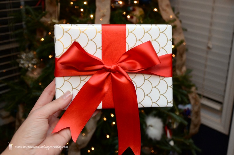 DIY gift wrapping with a perfect red ribbon bow