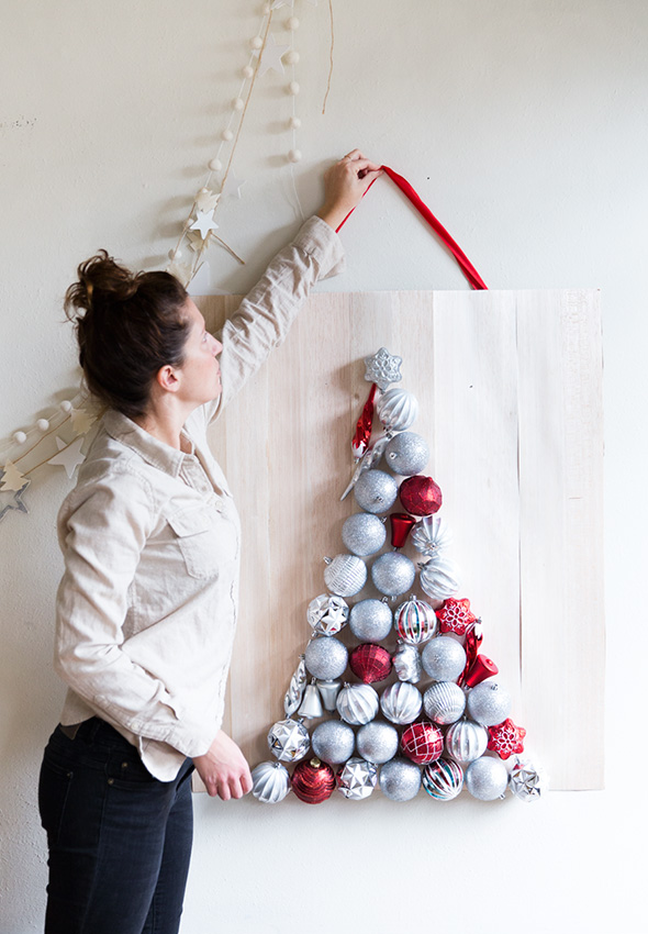 DIY Christmas ornament tree on a wooden plank