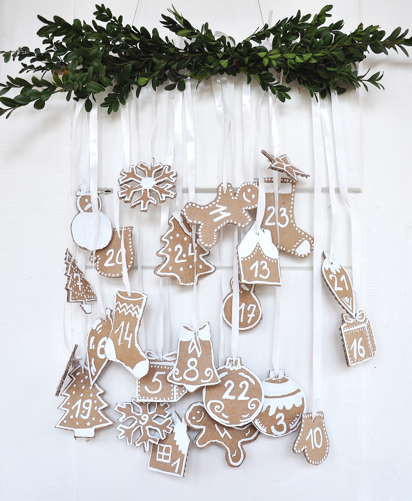 DIY advent calendar of cardboard and white paint