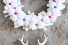 DIY crispy white pompom wreath with colorful yarn balls