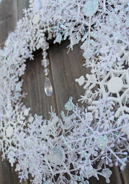 dollar store snowflakes in a wreath with crystals