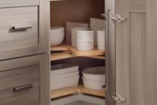 04 baking dishes stacked in a corner storage space