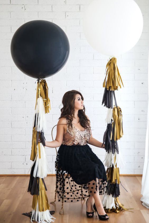 oversized balloons with colorful tassels