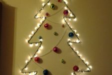 06 light garland tree with ornaments on the wall