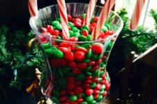 07 colorful M&Ms and candy canes in a jar for eating and creating a holiday mood