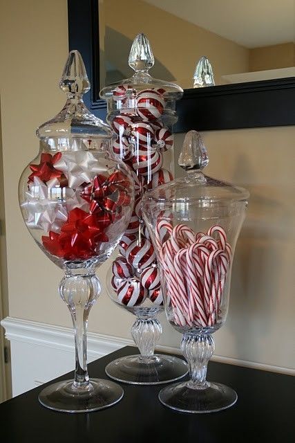 display bows, ornaments and candy canes in jars with lids