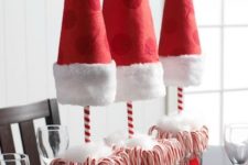 11 Santa hat and candy canes topiaries as Christmas centerpieces