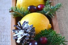 13 wooden tray with lemons, evergreens and cranberries for a centerpiece