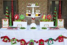 14 ugly sweater garland on the dessert table and glitter cone trees