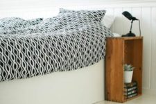 15 a crate placed vertically at the side of the bed