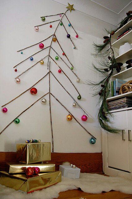 sticks attached to the wall and ornaments hanging on them